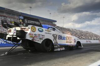 In this photo provided by the NHRA, John Force drives in Funny Car qualifying Saturday, April 30, 2022, at zMAX Dragway in Concord, N.C., at the Circle K NHRA Four-Wide Nationals drag races.  (Michael Allio/NHRA via AP)