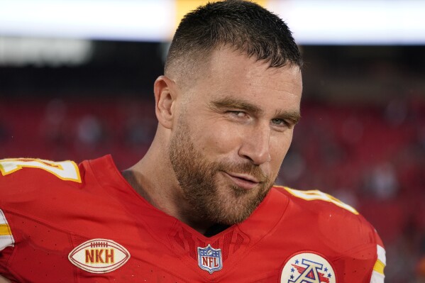 FILE - Kansas City Chiefs tight end Travis Kelce speaks during a post-game interview after an NFL football game Sunday, Oct. 22, 2023 in Kansas City, Mo. Kelce was voted the unanimous choice as the top tight end in the league by The Associated Press. A panel of nine AP Pro Football Writers ranked the top five players at tight end, making their selections based on current status midway through the 2023 season. (AP Photo/Ed Zurga, File)