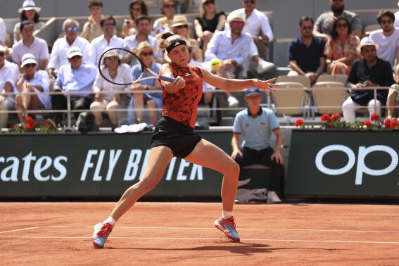 FILE - Karolina Muchova of the Czech Republic plays a shot against Poland's Iga Swiatek during the women's final match of the French Open tennis tournament at Roland Garros stadium in Paris, Saturday, June 10, 2023. Muchova had an operation on her right wrist for an injury that has sidelined her since September. “Following my injury at the U.S. Open and an extensive rehabilitation phase, it turned out that a medical intervention was necessary. So here I am, tired and sad, but I know I’ll be okay now,” Muchova wrote on social media Tuesday, Feb. 20, 2024. (AP Photo/Aurelien Morissard, File)