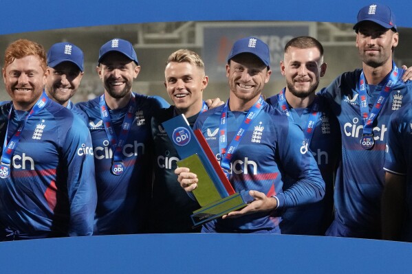 England's Jos Buttler holds the trophy after his team won the series of the One Day International cricket matches between England and New Zealand, at The Oval cricket ground in London, Friday, Sept. 15, 2023. (AP Photo/Kirsty Wigglesworth)