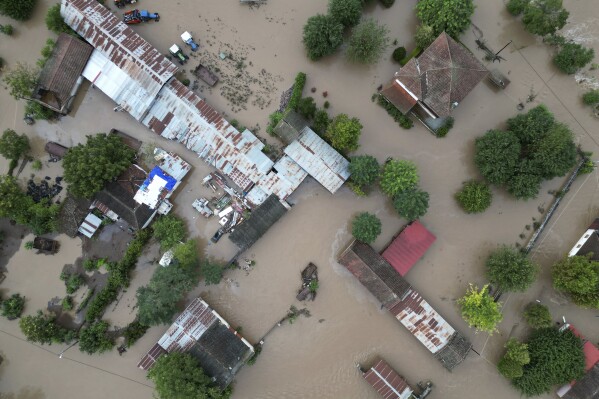 Floodwaters cover a farm and a house after the country's record rainstorm in the village of Kastro, near Larissa, Thessaly region, central Greece, Thursday, Sept. 7, 2023. The death toll from severe rainstorms that lashed parts of Greece, Turkey and Bulgaria increased after rescue teams in the three neighboring countries recovered more bodies. (AP Photo/Vaggelis Kousioras)
