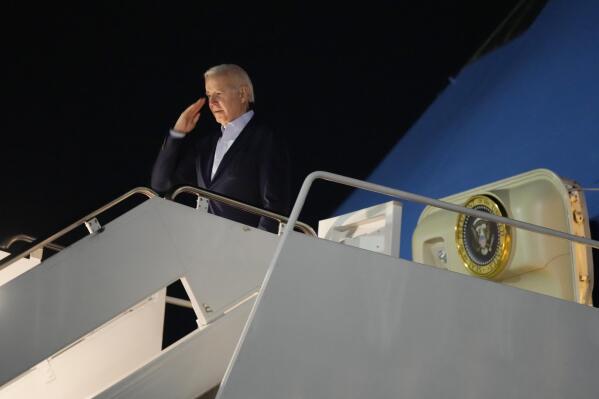 President Joe Biden salutes as he boards Air Force One at Andrews Air Force Base, Md., on Tuesday, Dec. 27, 2022. Biden and his family are traveling to St. Croix, U.S. Virgin Islands, to celebrate New Year. (AP Photo/Manuel Balce Ceneta)