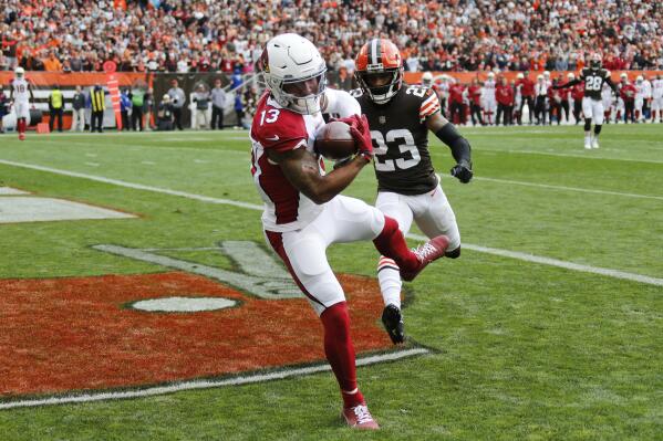 Arizona Cardinals wide receiver Christian Kirk (13) catches a 21-yard touchdown pass against Cleveland Browns cornerback Troy Hill (23) during the first half of an NFL football game, Sunday, Oct. 17, 2021, in Cleveland. (AP Photo/Ron Schwane)