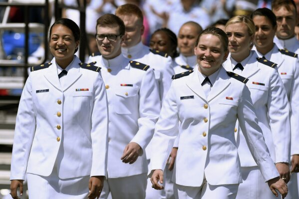 FILE - In this May 22, 2019 file photo, future United State Coast Guard graduates arrive at the commencement ceremony in New London, Conn. Released Wednesday, July 3, 2019, a Pentagon report from an anonymous 2018 gender relations survey shows that almost half of female cadets at the U.S. Coast Guard Academy said they experienced sexual harassment and about one in eight women reported experiencing unwanted sexual contact. (AP Photo/Jessica Hill, File)