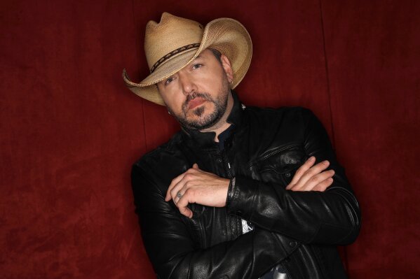
              FILE - In this March 19, 2018, file photo, Jason Aldean poses in Nashville, Tenn. Aldean, Carrie Underwood and Florida Georgia Line are the leading nominees for the CMT Music Awards with four each. Little Big Town, who are nominated for three awards, will host the show, which airs on June 6 at 8 p.m. Eastern on CMT. (AP Photo/Mark Humphrey, File)
            