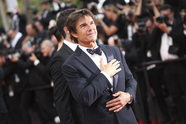 Tom Cruise poses for photographers upon arrival at the premiere of the film 'Top Gun: Maverick' at the 75th international film festival, Cannes, southern France, Wednesday, May 18, 2022. (Photo by Vianney Le Caer/Invision/AP)
