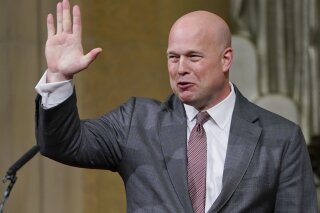 
              Acting Attorney General Matthew Whitaker gestures after speaking at the Dept. of Justice's Annual Veterans Appreciation Day Ceremony, Thursday, Nov. 15, 2018, at the Justice Department in Washington. (AP Photo/Pablo Martinez Monsivais)
            