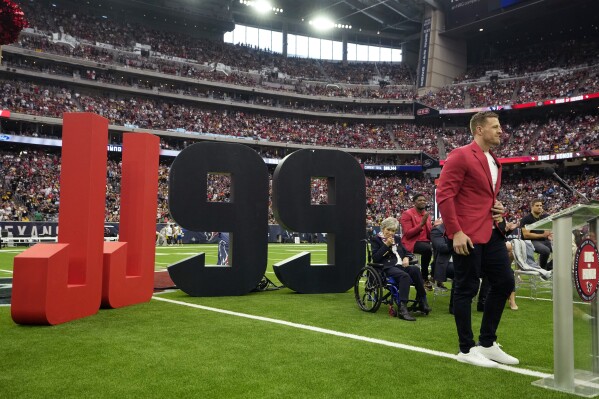 Former Houston Texans player J.J. Watt is honored during a ceremony to retire his jersey number during an NFL football game between the Houston Texans and the Pittsburgh Steelers, Sunday, Oct. 1, 2023, in Houston. (AP Photo/David J. Phillip)