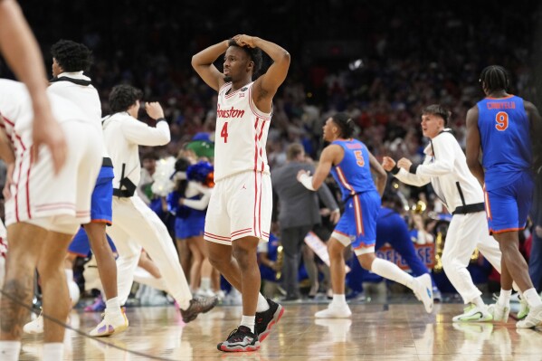 Houston's L.J. Cryer (4) reacts after Houston lost to Florida in the national championship at the Final Four of the NCAA college basketball tournament, Monday, April 7, 2025, in San Antonio. (AP Photo/Eric Gay)