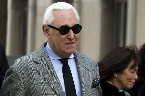 Roger Stone accompanied by his wife Nydia Stone, right, arrives at federal court in Washington, Thursday, Nov. 14, 2019. (AP Photo/Jose Luis Magana)
