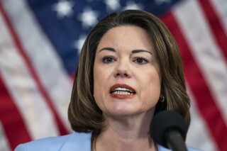 FILE - Rep. Angie Craig, D-Minn., speaks during a news conference on Capitol Hill on June 24, 2020, in Washington. A man who pleaded guilty to assaulting Democratic Rep. Angie Craig of Minnesota in the elevator of her Washington apartment was sentenced to more than two years in behind bars on Thursday. Twenty-seven-year-old Kendrid Khalil Hamlin apologized to Craig and said he wants to get mental health and substance abuse treatment. (AP Photo/Manuel Balce Ceneta, File)