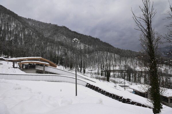 A view of the empty bobsled track used in the 2014 Winter Olympics in Krasnaya Polyana, Russia on Wednesday, Feb. 7, 2024. The nearby Black Sea resort of Sochi, which hosted the Ganes, has continued to serve as a venue for winter sports and some international sporting events until they were pulled from Russia in response to the conflict in Ukraine. (AP Photo)