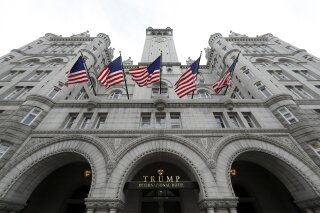 FILE - This Dec. 21, 2016 file photo shows the Trump International Hotel at 1100 Pennsylvania Avenue NW, in Washington. The attorneys general of the District of Columbia and Maryland plan to file subpoenas seeking records from the Trump Organization, the IRS and other entities in their lawsuit accusing Donald Trump of profiting off the presidency. (AP Photo/Alex Brandon, File)
