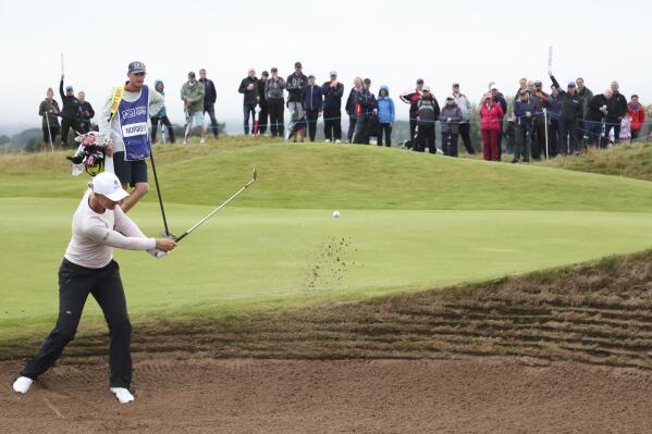 Sweden's Anna Nordqvist plays out of a bunker on the 14th green during the third round of the Women's British Open golf championship, in Carnoustie, Scotland, Saturday, Aug. 21, 2021. (AP Photo/Scott Heppell)