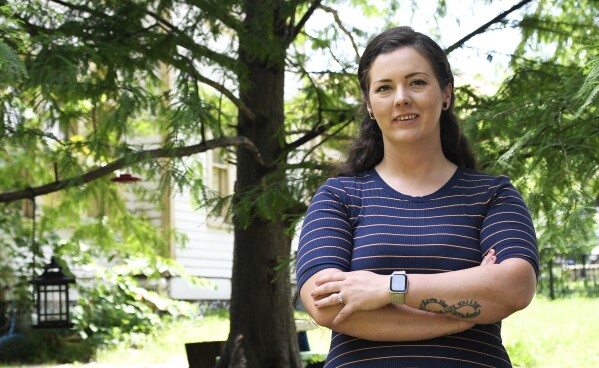 Brittnee Nelson, who runs her own housecleaning business, poses for a portrait in her neighborhood in Shreveport, La., Monday, June 9, 2025. (AP Photo/Jill Pickett)
