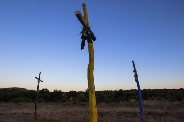 Apache religious symbols are posted at Oak Flat Campground, a sacred site for Native Americans located 70 miles east of Phoenix, on June 3, 2023, in Miami, Ariz. Oak Flat is a site for coming-of-age rituals for Apache women, healing sweat lodge ceremonies, and other big and small moments in the lives of Natives. (AP Photo/Ty O'Neil)