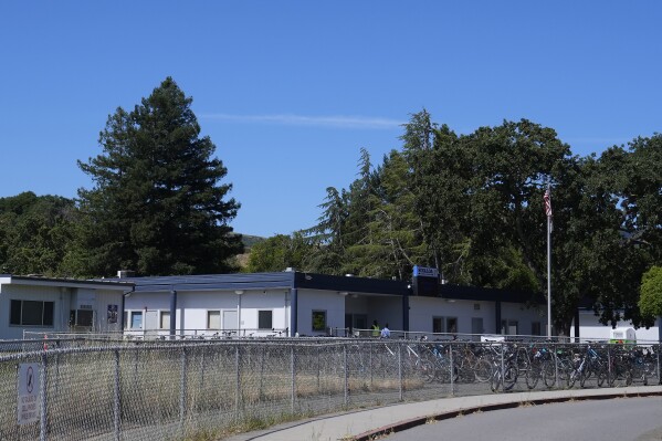 A building at Sinaloa Middle School is shown in Novato, Calif., Thursday, May 30, 2024. Eight Northern California middle school students have been arrested after a planned assault on a fellow student that other students recorded last week, police said. The attack occurred after lunch last Friday at Sinaloa Middle School in the Marin County city of Novato, about 25 miles (40 kms.) north of San Francisco. (AP Photo/Jeff Chiu)