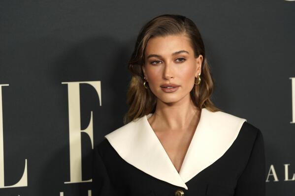 FILE - Hailey Bieber arrives at the 27th annual ELLE Women in Hollywood celebration on Tuesday, Oct. 19, 2021, at the Academy Museum of Motion Pictures in Los Angeles. The model says on Saturday, March 12, 2022, that she's fine after a health scare, suffering a small blood clot to her brain. Bieber, wife of pop star Justin Bieber, posted on Instagram Saturday that she was having breakfast with her husband on Thursday when she began feeling stroke-like symptoms. (AP Photo/Chris Pizzello, File)