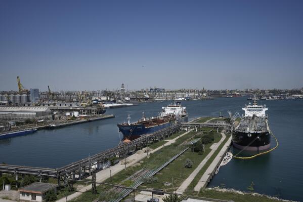 FILE - Ships are docked in the Black Sea port of Constanta, Romania, Tuesday, June 21, 2022. Neighbors Romania, Ukraine, and Moldova signed joint agreements on Thursday, April 13, 2023, in Romania's capital after a trilateral security meeting that focussed on ways to strengthen security in their Black Sea region to counter threats posed by Russian aggression. (AP Photo/Vadim Ghirda, File)