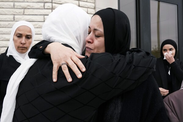 Muslim community members mourn the death of Wadea Al Fayoume at Mosque Foundation in Bridgeview, Ill., Monday, Oct. 16, 2023. An Illinois landlord accused of fatally stabbing the 6-year-old Muslim boy and seriously wounding his mother was charged with a hate crime after police and relatives said he singled out the victims because of their faith and as a response to the war between Israel and Hamas. (AP Photo/Nam Y. Huh)