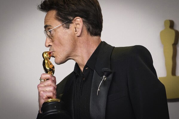 Robert Downey Jr. poses with the award for best performance by an actor in a supporting role for "Oppenheimer" in the press room at the Oscars on Sunday, March 10, 2024, at the Dolby Theatre in Los Angeles. (Photo by Jordan Strauss/Invision/AP)