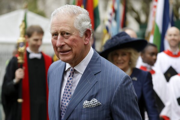FILE - In this Monday, March 9, 2020 file photo, Britain's Prince Charles and Camilla the Duchess of Cornwall, in the background, leave after attending the annual Commonwealth Day service at Westminster Abbey in London, Monday, March 9, 2020. Prince Charles, the heir to the British throne, has tested positive for the new coronavirus. The prince’s Clarence House office reported on Wednesday, March 25, 2020 that the 71-year-old is showing mild symptoms of COVID-19 and is self-isolating at a royal estate in Scotland. For most people, the coronavirus causes mild or moderate symptoms, such as fever and cough that clear up in two to three weeks (AP Photo/Kirsty Wigglesworth, File)