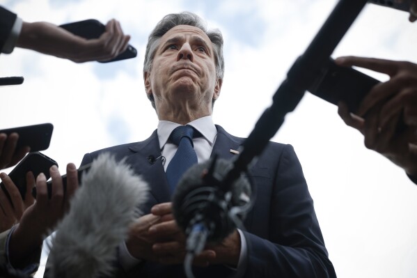 U.S. Secretary of State Antony Blinken speaks to members of the media before boarding his plane to return to Washington, following his week-long trip aimed at calming tensions across the Middle East, in Cairo, Egypt, Thursday Jan. 11, 2024. (Evelyn Hockstein/Pool via AP)