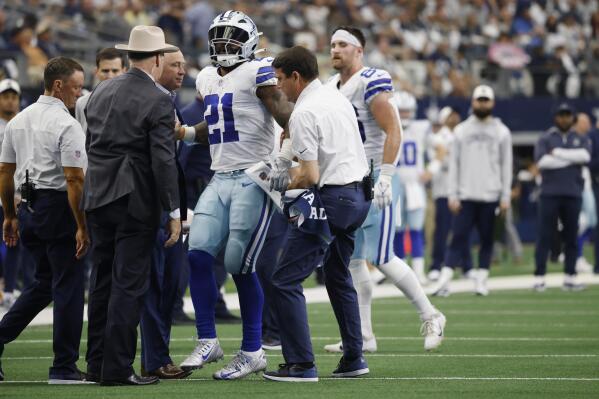 Dallas Cowboys running back Ezekiel Elliott (21) leaves the field following  the Dallas Cowboys and the Philadelphia Eagles NFL football game in  Arlington, Texas, Monday, Sept. 27, 2021. (AP Photo/Ron Jenkins Stock