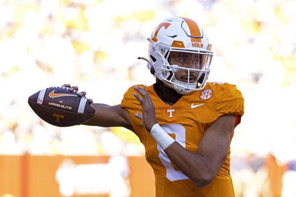 Tennessee quarterback Nico Iamaleava (8) warms up during the second half of an NCAA college football game against UConn, Saturday, Nov. 4, 2023, in Knoxville, Tenn. (AP Photo/Wade Payne)