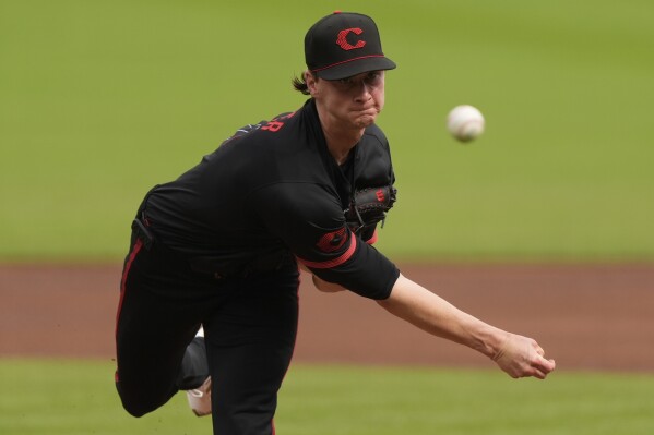 Cincinnati Reds pitcher Brady Singer throws in the first inning of a baseball game against the Cleveland Guardians, Friday, May 16, 2025, in Cincinnati. (AP Photo/Carolyn Kaster)