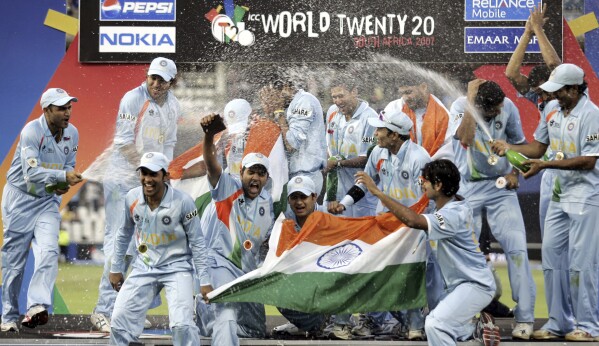 FILE - Indian cricket players celebrate after beating Pakistan during the final Twenty20 World Championship Cricket match between India and Pakistan in Johannesburg, South Africa, Monday, Sept. 24, 2007. The ninth T20 World Cup starts on June 1. The Caribbean and the United States are sharing co-host duties. (AP Photo/Aman Sharma, File)