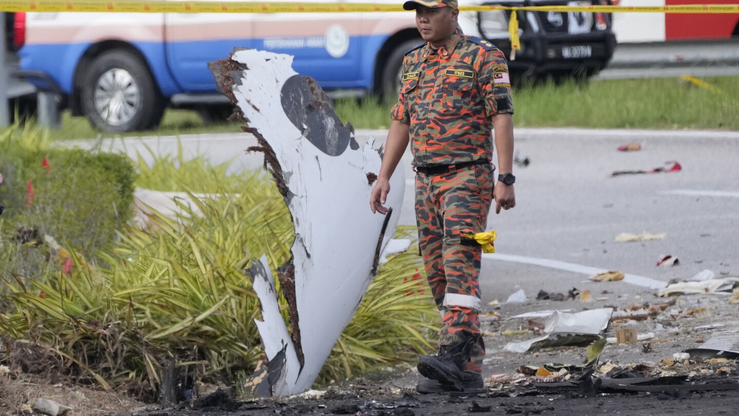 Small plane crashes on a Malaysian highway, killing all 8 people on