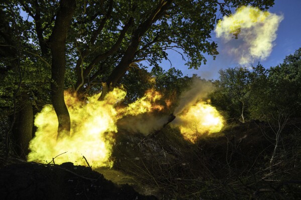A Ukrainian self propelled artillery of 30th brigade fires towards Russian position in Donetsk region, Ukraine, Tuesday, June 20, 2023. (AP Photo/Evgeniy Maloletka)
