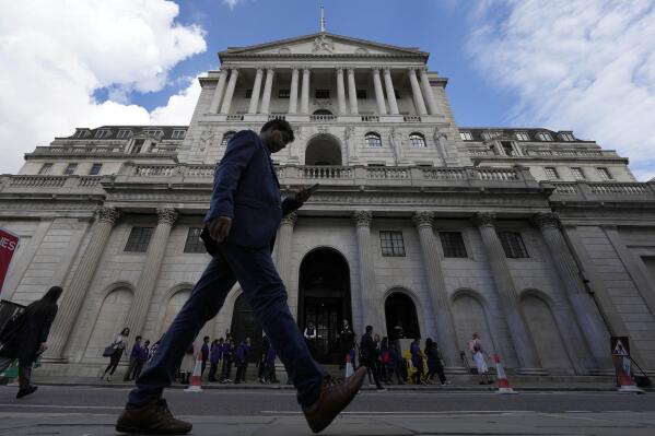A man walks past the Bank of England, at the financial district in London, Thursday, May 11, 2023. The Bank of England is set to raise interest rates later Thursday to their highest level since late 2008 as it continues to combat stubbornly high inflation in the U.K. (AP Photo/Frank Augstein)