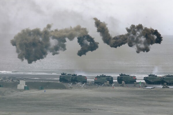 FILE - Taiwan's military holds drills of the annual Han Kuang military exercises that simulate an anti-landing operations near the coast in New Taipei City, northern Taiwan, Thursday, July 27, 2023. Taiwan military mobilized for routine defense exercises from July 24-28. The U.S. is set to announce $345 million in military aid for Taiwan, two U.S. officials said Friday. It would be the Biden administration's first major package drawing on America's own stockpiles under a new policy intended to speed up military aid to help Taiwan counter China. (AP Photo/Chiang Ying-ying, File)