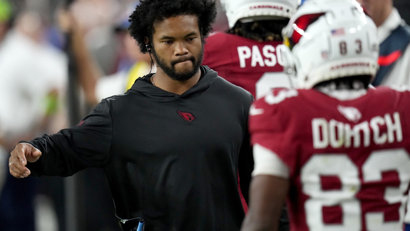 Minnesota Vikings wide receiver Justin Jefferson (18) talks with Arizona  Cardinals players after a NFL preseason