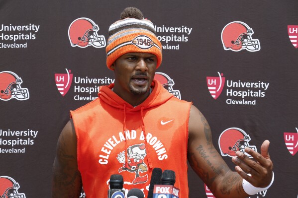FILE - Cleveland Browns quarterback Deshaun Watson answers a question during a press conference after practice at the NFL football team's practice facility Wednesday, June 7, 2023, in Berea, Ohio. This will be a very different training camp for the Cleveland Browns and quarterback Deshaun Watson. (AP Photo/Ron Schwane, File)