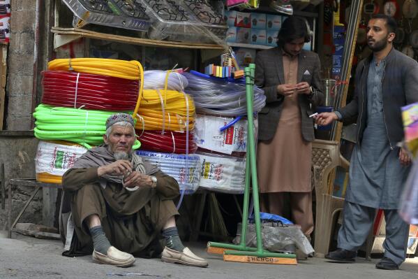 A day laborer waits for work at a market in Peshawar, Pakistan, Friday, Feb. 17, 2023. Many laborers are worried how they will survive after the government advanced a bill to raise 170 billion rupees in tax revenue. That could worsen impoverished Pakistan's economic outlook as it struggles to recover from devastating summer floods and a wave of violence. (AP Photo/Muhammad Sajjad)