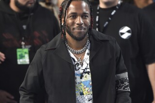 FILE - Kendrick Lamar arrives at the MTV Video Music Awards, on Aug. 27, 2017, in Inglewood, Calif. Rapper Lamar will headline Move Afrika: A Global Citizen Experience, a new initiative to establish an international touring circuit on the continent of Africa launching with a concert in Kigali, Rwanda, on Dec. 6, 2023. (Photo by Chris Pizzello/Invision/AP, File)