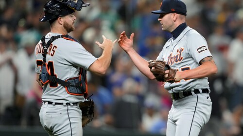 Detroit Tigers catcher Jake Rogers, left, congratulates relief pitcher Alex Lange, who earned a save in the team's 5-4 win over the Seattle Mariners in a baseball game Friday, July 14, 2023, in Seattle. (AP Photo/Lindsey Wasson)