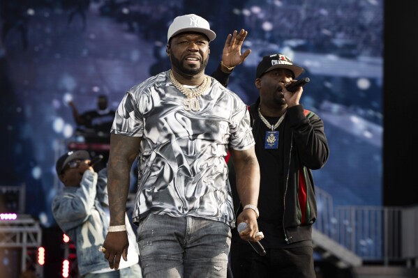 FILE - 50 Cent, left, and Tony Yayo perform at the Wireless Music Festival in Finsbury Park, July 9, 2023, in London. Rapper 50 Cent said Monday, Aug. 28, that his scheduled show Tuesday night, Aug. 29, at Talking Stick Resort Amphitheatre, an outdoor venue in west Phoenix, was postponed because of the sweltering weather. (Scott Garfitt/Invision/AP, File)