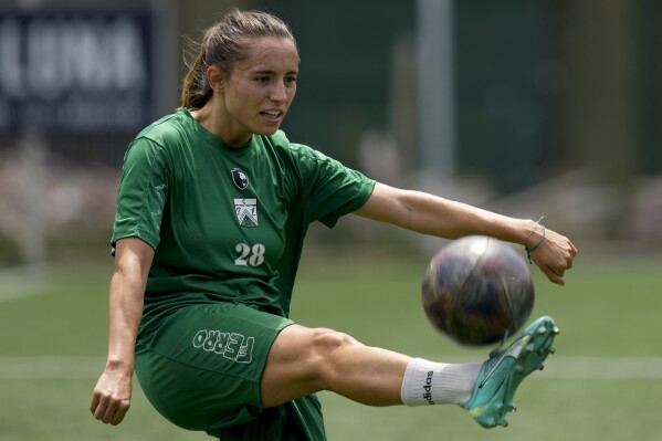 Ferrocarril Oeste's winger Eponine Howarth, from France, controls the ball during a women's professional team training session in Buenos Aires, Argentina, Friday, Feb. 16, 2024. (AP Photo/Natacha Pisarenko)