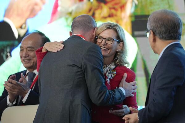 Doreen Bogdan-Martin of the United States, secretary general elect of the ITU, receives congratulations after a voting session of The International Telecommunication Union (ITU), the United Nations specialised agency for information and communication technologies, in Bucharest, Romania, Thursday, Sept. 29, 2022. The ITU Plenipotentiary Conference 2022 elected Bogdan-Martin, the first woman to ever hold the position of Secretary General.(AP Photo/Andreea Alexandru)