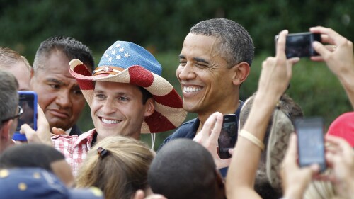 FILE - President Barack Obama poses for a photo during a visit with service members at the White House Independence Day celebration July 4, 2012, on the South Lawn of the White House in Washington. (AP Photo/Haraz N. Ghanbari, File)