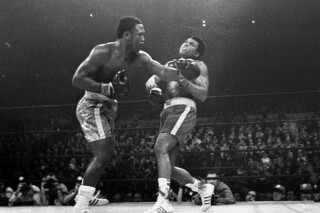 FILE - Joe Frazier hits Muhammad Ali with a left during the 15th round of their heavyweight title fight at New York's Madison Square Garden, in this March 8, 1971, file photo. (AP Photo/File)
