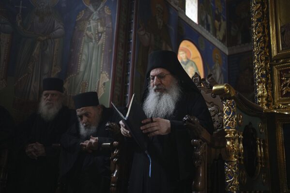 Archimandrite Eliseos, the abbot of Simonopetra, or Simonos Petra Monastery, prays during the afternoon liturgy at the all-male autonomous community of Agion Oros, or Holy Mountain, on the peninsula of Mount Athos in northern Greece, April 14, 2025. (AP Photo/Thanassis Stavrakis)