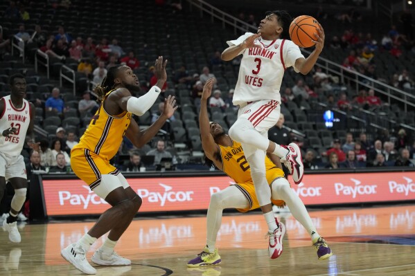 Utah guard Jayden Teat (3) shoots over Arizona State guard Braelon Green (2) during the second half of an NCAA college basketball game in the first round of the Pac-12 tournament Wednesday, March 13, 2024, in Las Vegas. (AP Photo/John Locher)