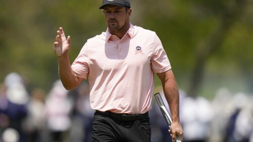 Bryson DeChambeau waves after his putt on the 15th hole during the first round of the PGA Championship golf tournament at Oak Hill Country Club on Thursday, May 18, 2023, in Pittsford, N.Y. (AP Photo/Seth Wenig)