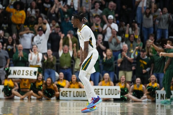 Baylor's Ja'Kobe Walter reacts after scoring a basket against Texas during the second half of an NCAA college basketball game, Monday, March 4, 2024, in Waco, Texas. Baylor won 93-85. (AP Photo/Julio Cortez)