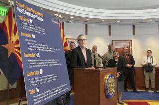 Arizona Gov. Katie Hobbs speaks at a news conference at the Executive Tower on Monday, May 8, 2023, in Phoenix. Hobbs expressed frustration on the absence of a satisfactory plan and funding from the federal government with the end of Title 42 coming on Thursday. (AP Photo/Terry Tang)